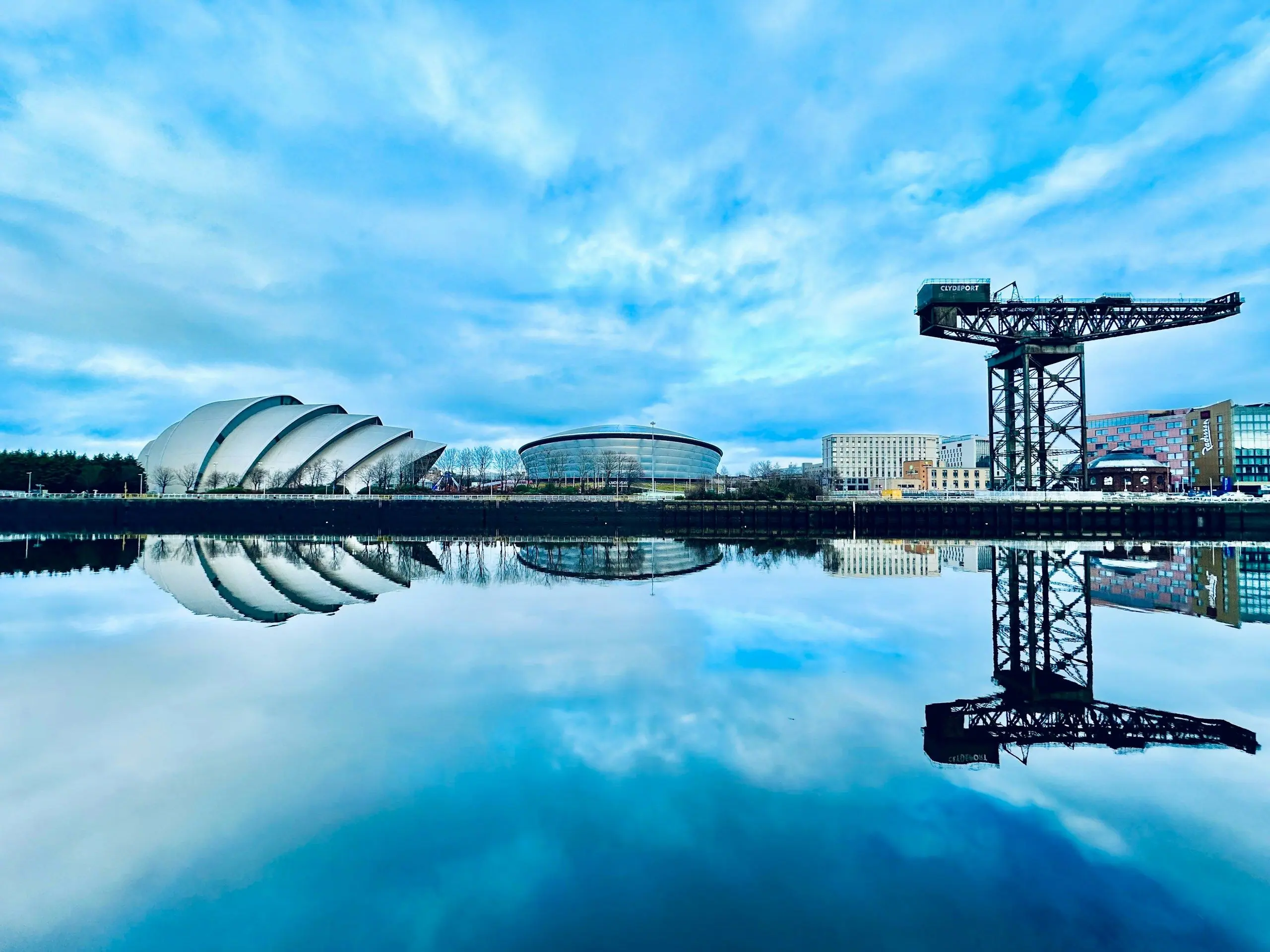 The River Clyde at Finnieston with the Finnieston Crane and the SEC Armadillo reflected in the water